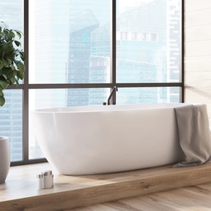 Bathtub next to window
